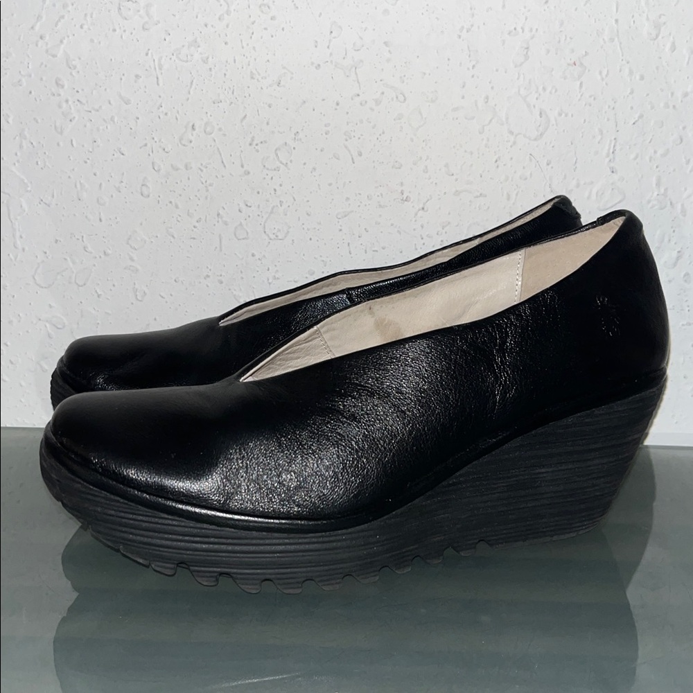 NWOT Fly London Yaz leather wedge pumps.
